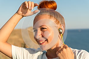 Fitness girl with wireless headphones