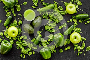Fitness greeny drink with vegetables on dark background top view mock-up
