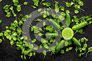 Fitness greeny drink with vegetables on dark background top view mock-up