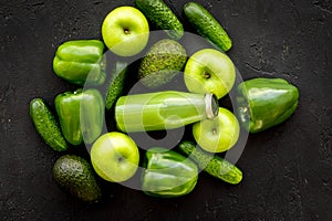 Fitness greeny drink with vegetables on dark background top view mock-up