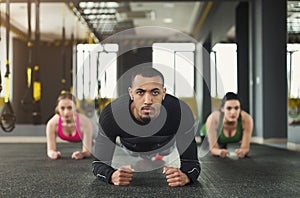 Fitness group plank training indoors