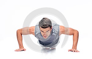 Fitness handsome man doing push ups