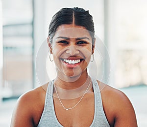 Fitness, happy and portrait of a woman in the gym after a workout for health and wellness. Happiness, smile and headshot photo