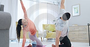 Fitness, health and couple doing yoga in the living room together for body, mind and spiritual wellness. Calm