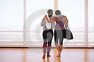 Fitness, hug and back of friends at gym walking after training, exercise or sports routine. Workout, club and women with