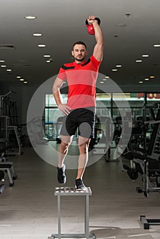 Fitness Instructor Doing Heavy Weight Exercise With Kettle-bell