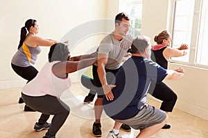 Fitness Instructor In Exercise Class For Overweight People