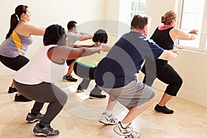 Fitness Instructor In Exercise Class For Overweight People