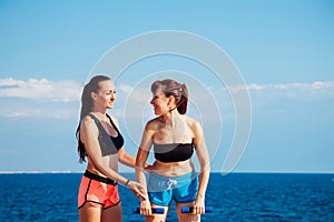 Fitness instructor teaches a woman to play sports