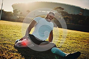 Fitness, leg injury and pain with a sports man stretching outdoor before a workout for health. Exercise, stretching and