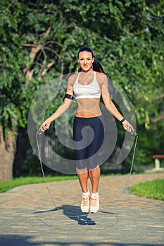 Fitness and lifestyle concept - woman doing sports