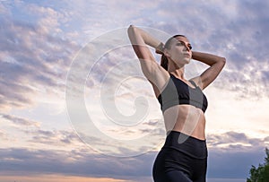 fitness and lifestyle concept - woman doing sports outdoors on a beach