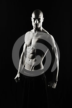 Fitness man on black background