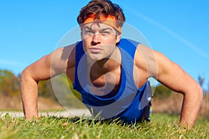 Fitness man doing push ups