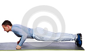 Fitness man doing push ups on mat