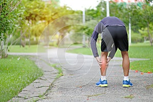 fitness man holding his sports injury, muscle painful during training