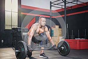 Fitness man lifting weights in gym fitness, Muscular man working out in gym doing exercises with barbell weight