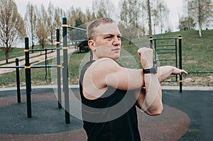 Fitness man with perfect body doing abdominal exercises in the Gym