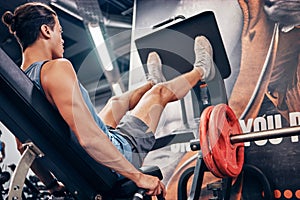 Fitness, man and power weightlifting with legs for intense workout, training or exercise at the gym. Strong athletic