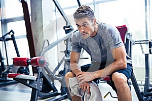 Fitness man resting at gym