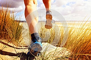 Fitness man running on the beach