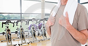 Fitness man Torso with a towel in a gym