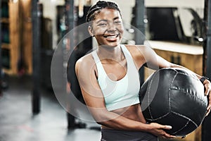 Fitness, medicine ball and portrait of black woman in gym for strength training or workout. Equipment, exercise and