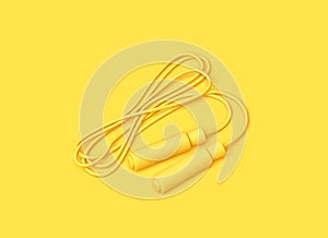 Fitness minimal concept. Yellow jumping rope on yellow backgroung