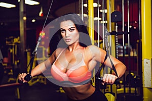 fitness model doing sport exercise in gym