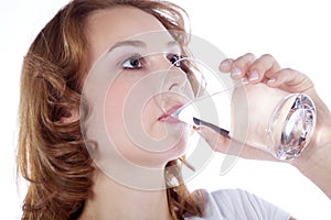 Fitness model drinking a glass water