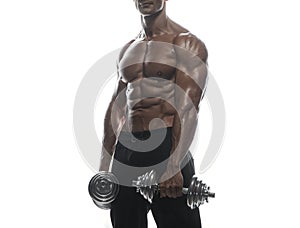 Fitness model man posing in studio