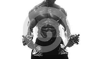 Fitness model man posing in studio