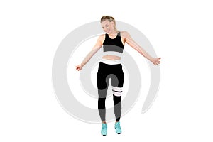 Fitness model woman focused on sport goals. Beautiful woman wearing sport clothes posing on white back ground - Image