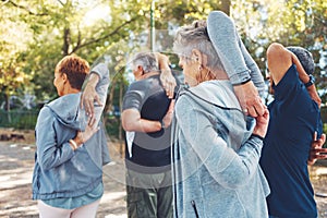 Fitness, nature and senior people doing stretching exercise before cardio training in a park. Health, wellness and