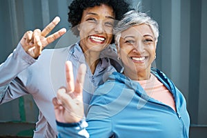 Fitness, peace sign and portrait of senior women bonding and posing after a workout or exercise together. Happy, smile