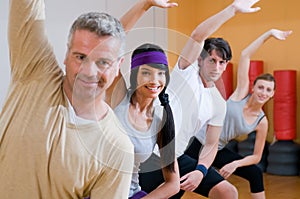 Fitness people doing aerobic exercises photo