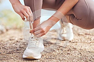 Fitness, person and hands lace shoes before workout for cardio, running or marathon training. Wellness, feet and legs of