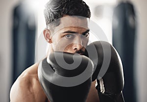 Fitness portrait of man boxer ready to punch during mma, boxing or fighting workout. Athlete boxing in the gym during