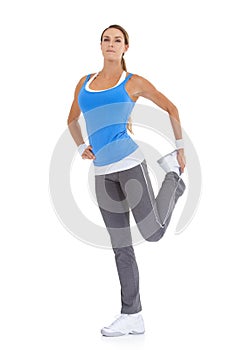 Fitness, portrait and woman stretching in studio for leg exercise, training or workout. Sports, health and young female