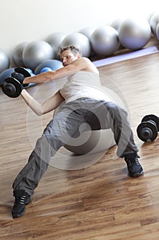 Fitness program, weight lifting on stability ball