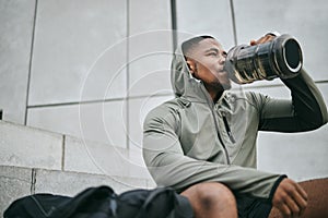 Fitness, relax or black man drinking water in training or exercise for body recovery or workout in Chicago, USA