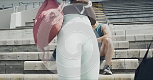 Fitness, relax and urban people finish with outdoor exercise routine, wellness training or practice in stadium arena