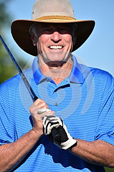 Fitness Retiree Male Golfer Smiling With Golf Club Playing Golf