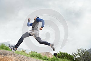 Fitness, runner and man running in nature training, cardio exercise and endurance workout for wellness. Sports