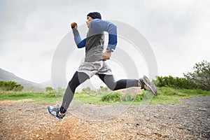 Fitness, runner and man running in nature training, cardio exercise and endurance workout for wellness. Sports