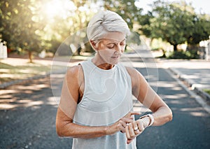 Fitness runner or senior woman with smartwatch check exercise results, process or goal for healthy, wellness lifestyle