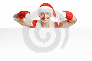 Fitness Santa Claus with a banner sales