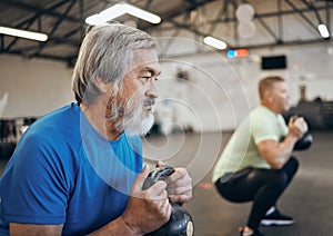 Fitness, senior and man workout with personal trainer at the gym squat with kettlebell equipment for strength. Elderly