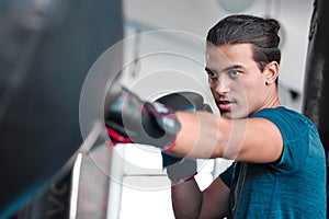 Fitness, serious man and boxing for exercise, workout or practice training at the gym for fight. Active and focused male