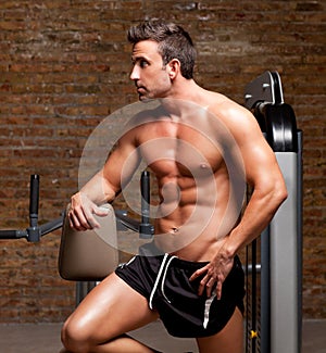 Fitness shaped muscle man posing on gym